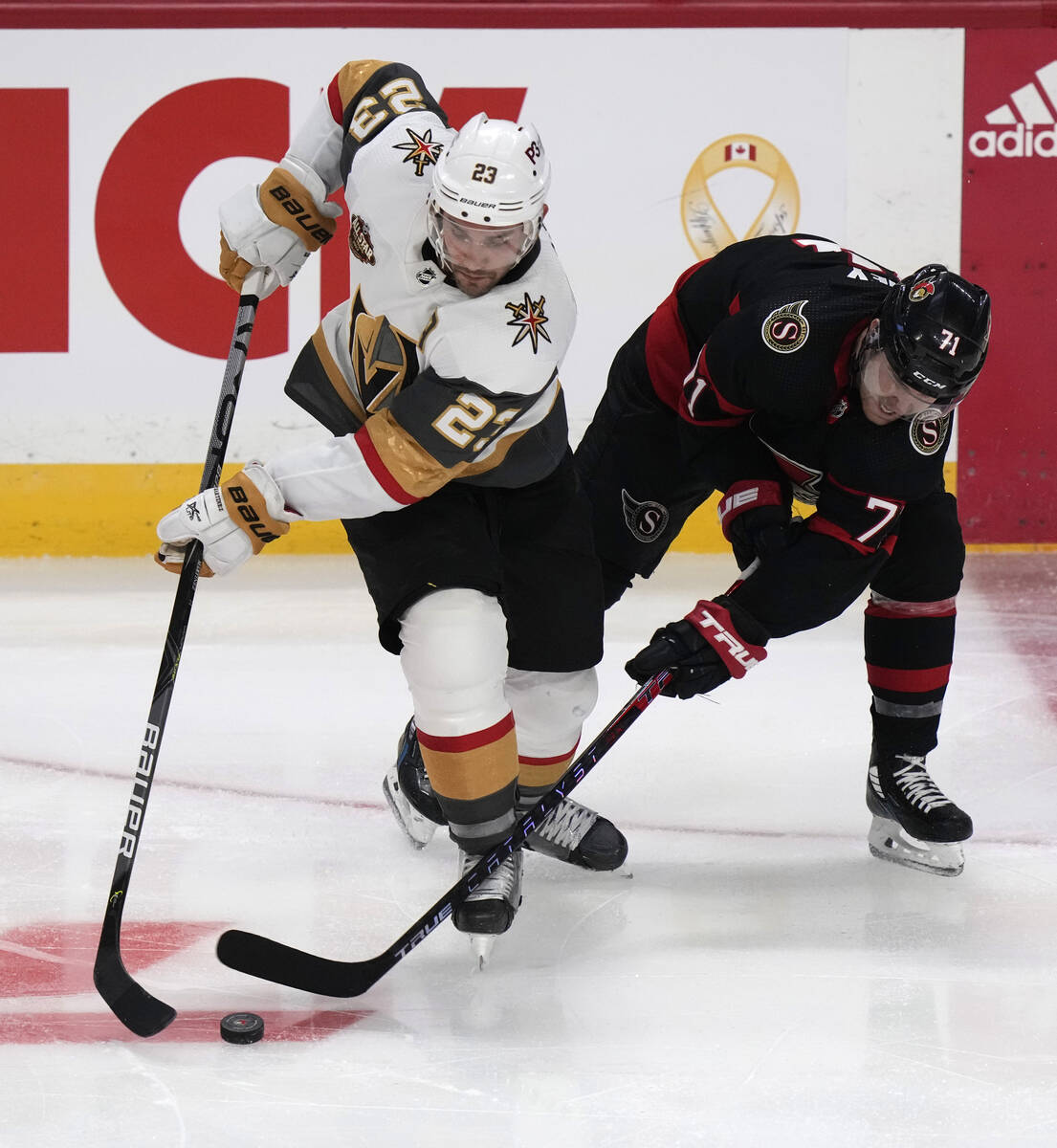 Vegas Golden Knights defenseman Alec Martinez takes the puck away from Ottawa Senators center C ...