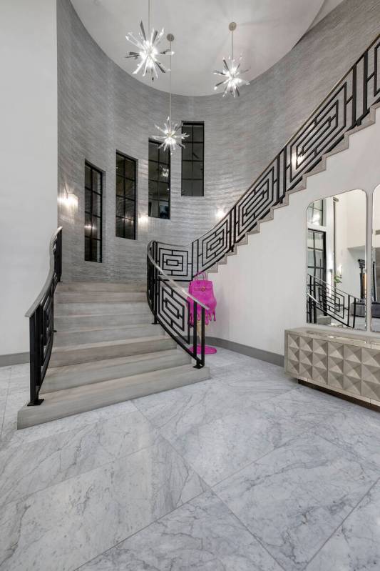 At the base of the staircase is a freestanding pop art piece, by artist Becky Rosa, Berg had sh ...