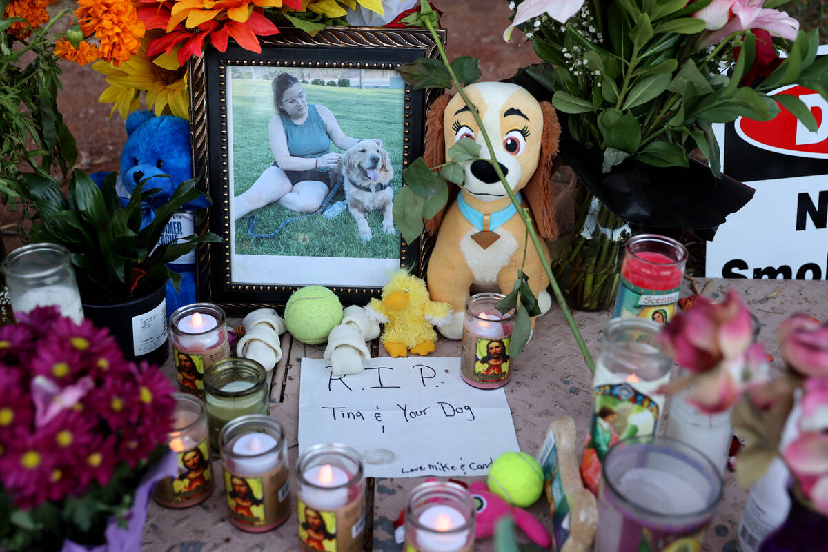 A photo of Tina Tintor and her dog Max in a memorial at Rainbow Boulevard and Spring Valley Par ...