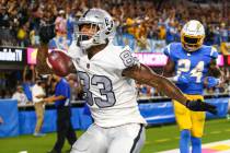 Raiders tight end Darren Waller (83) scores a touchdown against Los Angeles Chargers defensive ...
