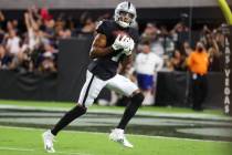Raiders wide receiver Zay Jones (7) makes a catch for a touchdown to win the game in overtimes ...