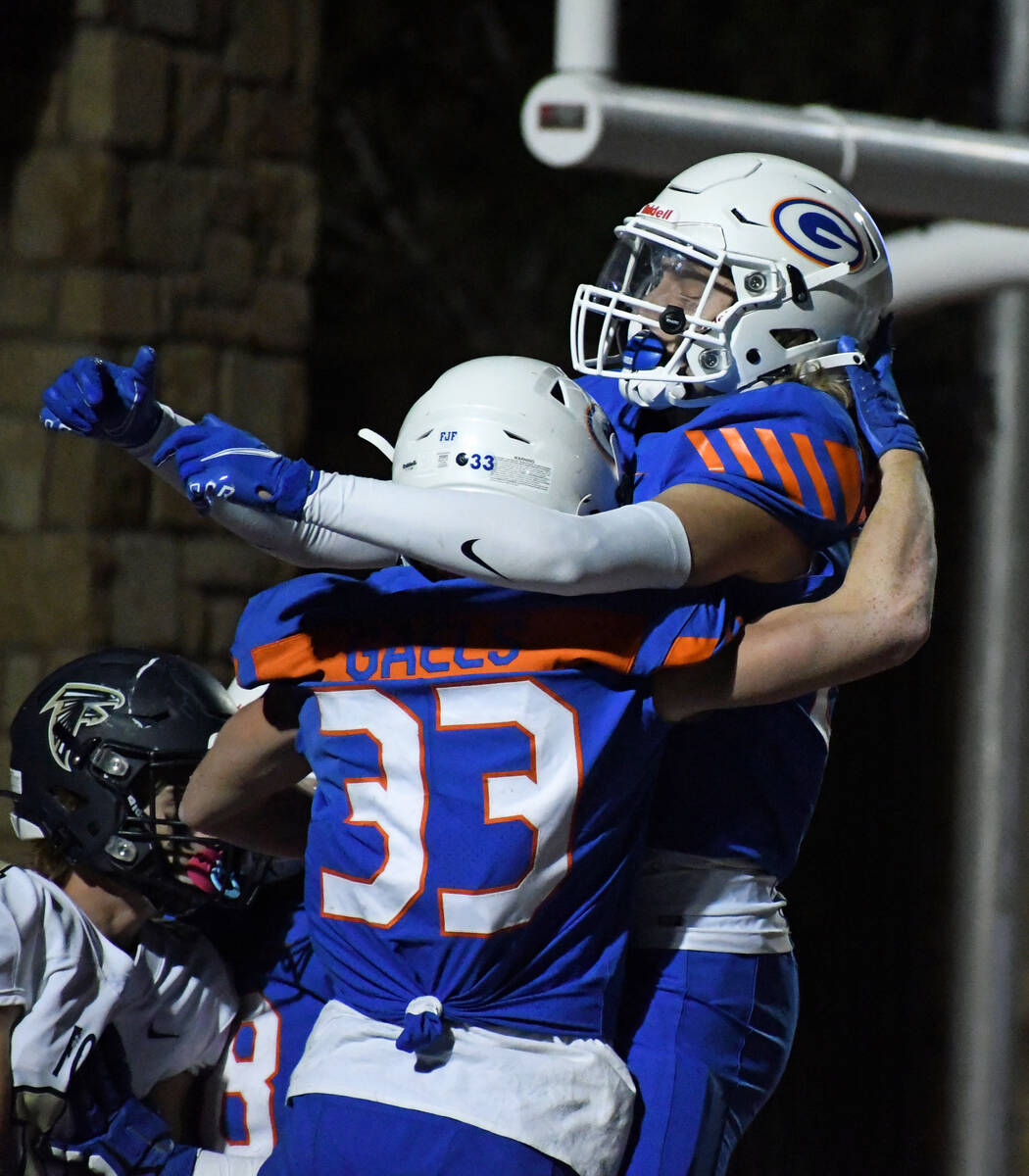 Cam Gray (33) celebrates a touchdown during a 5A region semifinal at Bishop Gorman on Friday, N ...