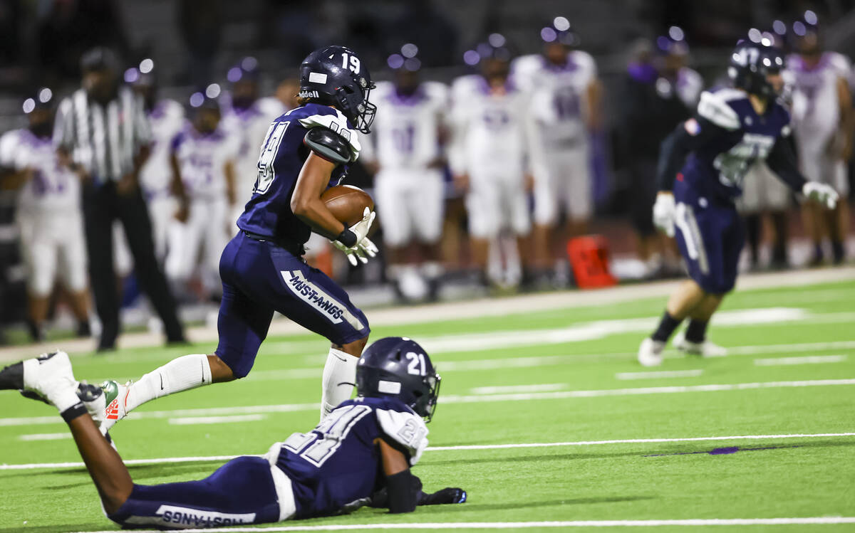 Shadow Ridge's Devon Poloa (19) returns the ball against Durango during the first half of a foo ...