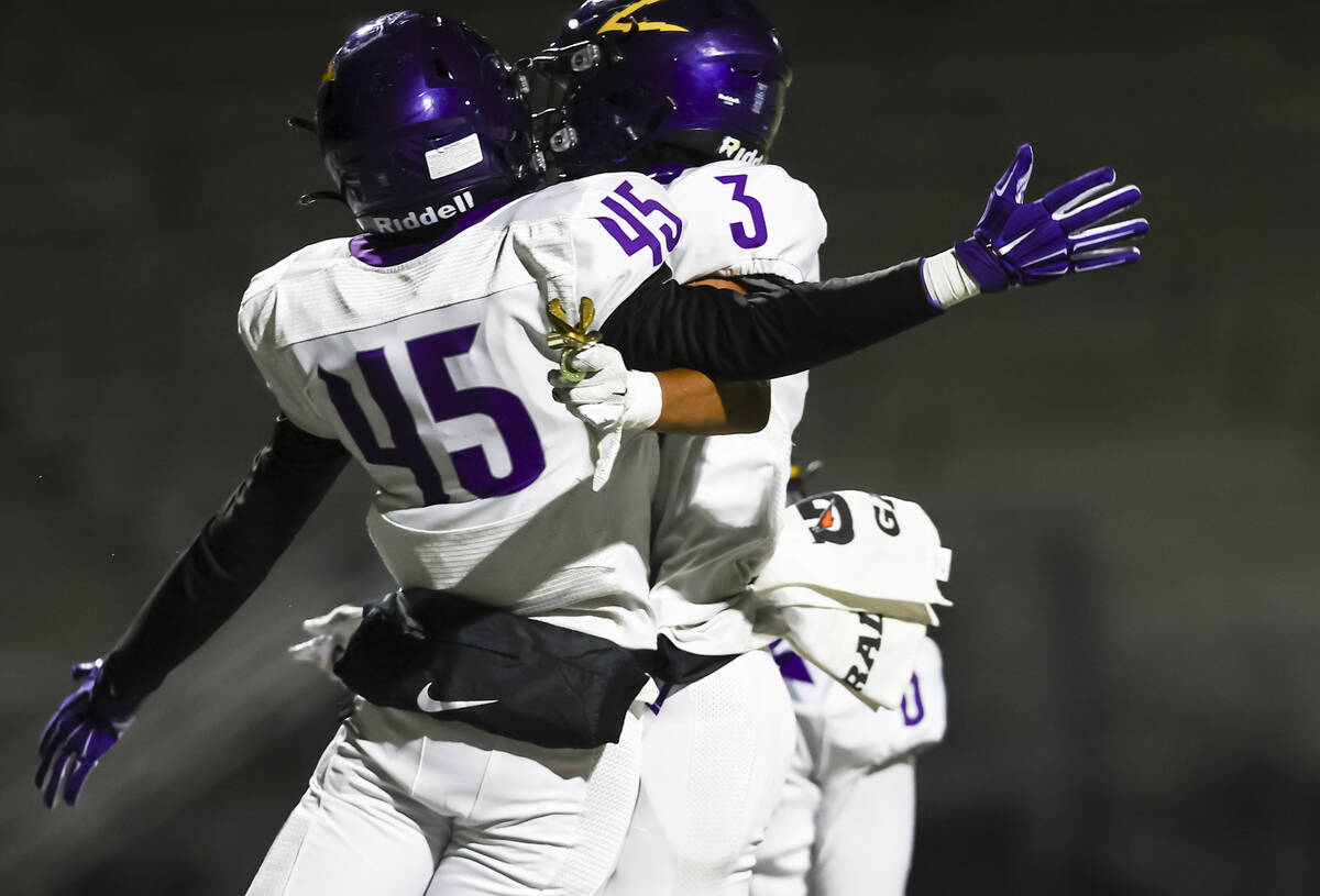 Durango's Sterling Lewis (45) celebrates his touchdown with Durango's Jaxon Young (3) during th ...