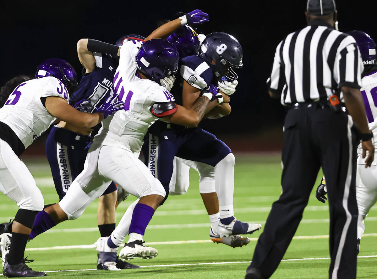 Durango's Shayson See (44) takes down Shadow Ridge's Coen Coloma (8) during the first half of a ...