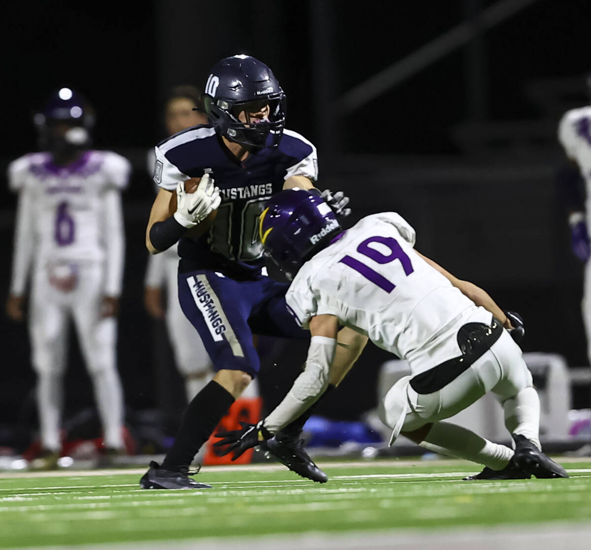 Shadow Ridge's Maddyx Valenzuela (10) runs the ball against Durango's Tyler Robbins (19) during ...
