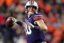 Auburn quarterback Bo Nix (10) looks for a receiver during the first half of the team's NCAA co ...