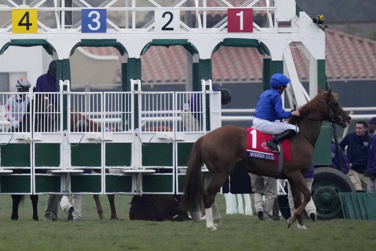 William Buick rides Modern Games after breaking through the starting gate before the start of t ...