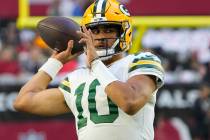 Green Bay Packers quarterback Jordan Love (10) warms up prior to an NFL football game against t ...