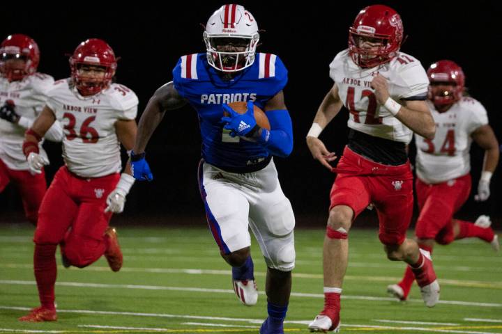 Liberty High wide receiver Germie Bernard (2) breaks through Arbor View defense during a playof ...