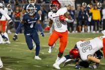 UNLV running back Charles Williams (8) runs for a touchdown against Nevada in the second half o ...