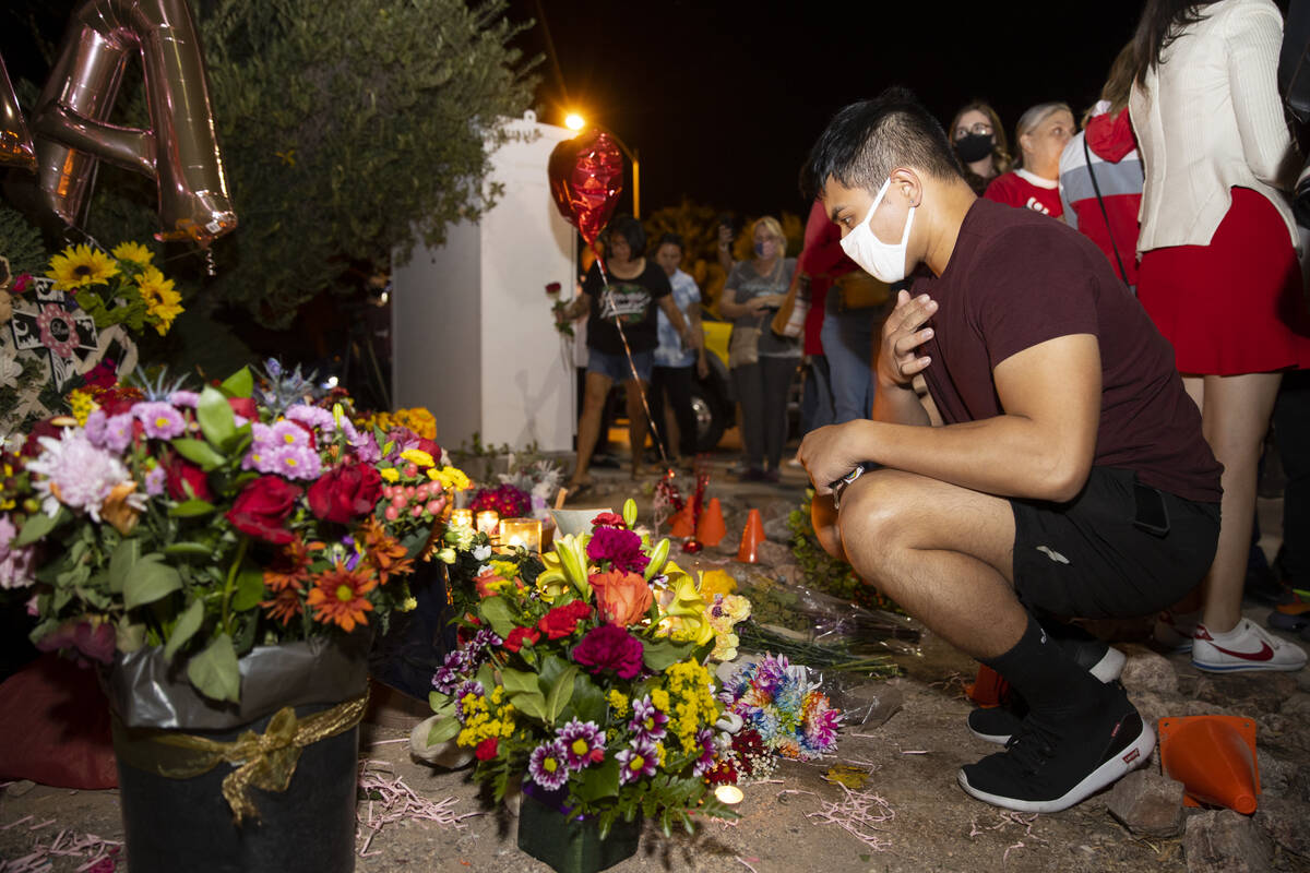 Joey Cruz attends a vigil for his coworker Tina Tintor and her dog Max at a memorial on Rainbow ...