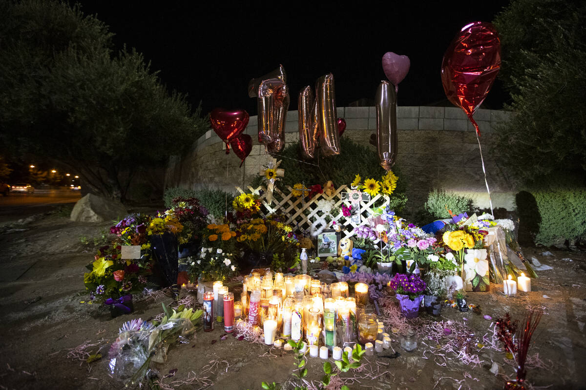 A memorial for Tina Tintor and her dog Max on Rainbow Boulevard and Spring Valley Parkway is se ...