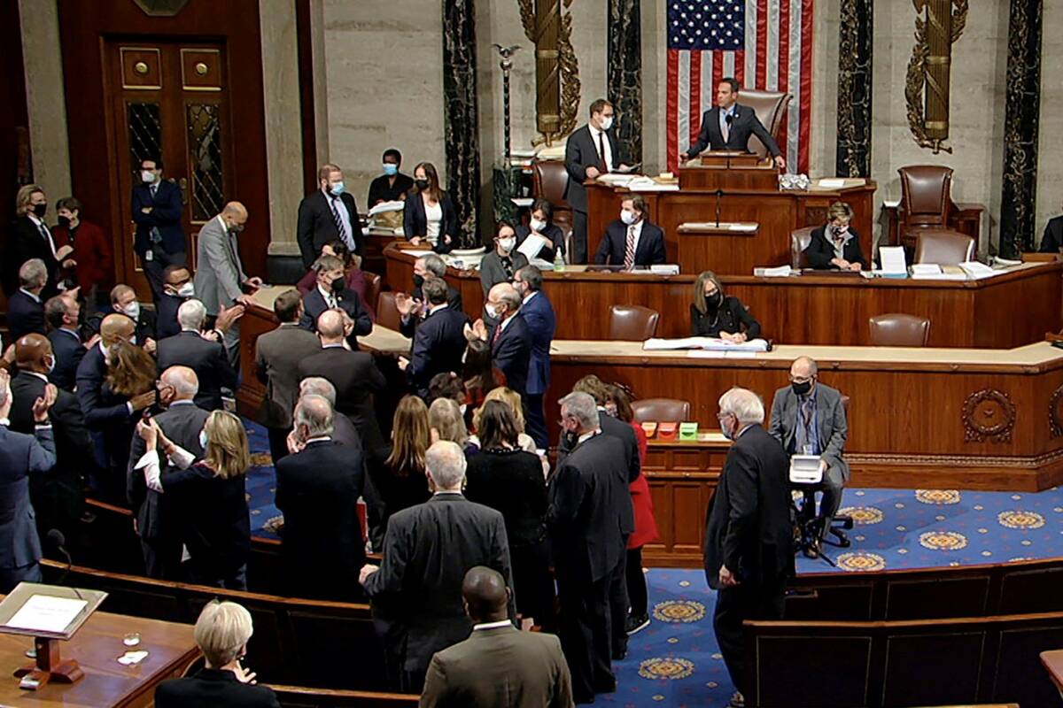 Democrats celebrate on the House floor late Friday, Nov. 5, 2021, in Washington, after the Hous ...