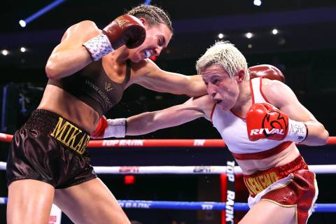 Mikaela Mayer (L) and Maiva Hamadouche (R) exchange punches during their fight for the WBO & IB ...