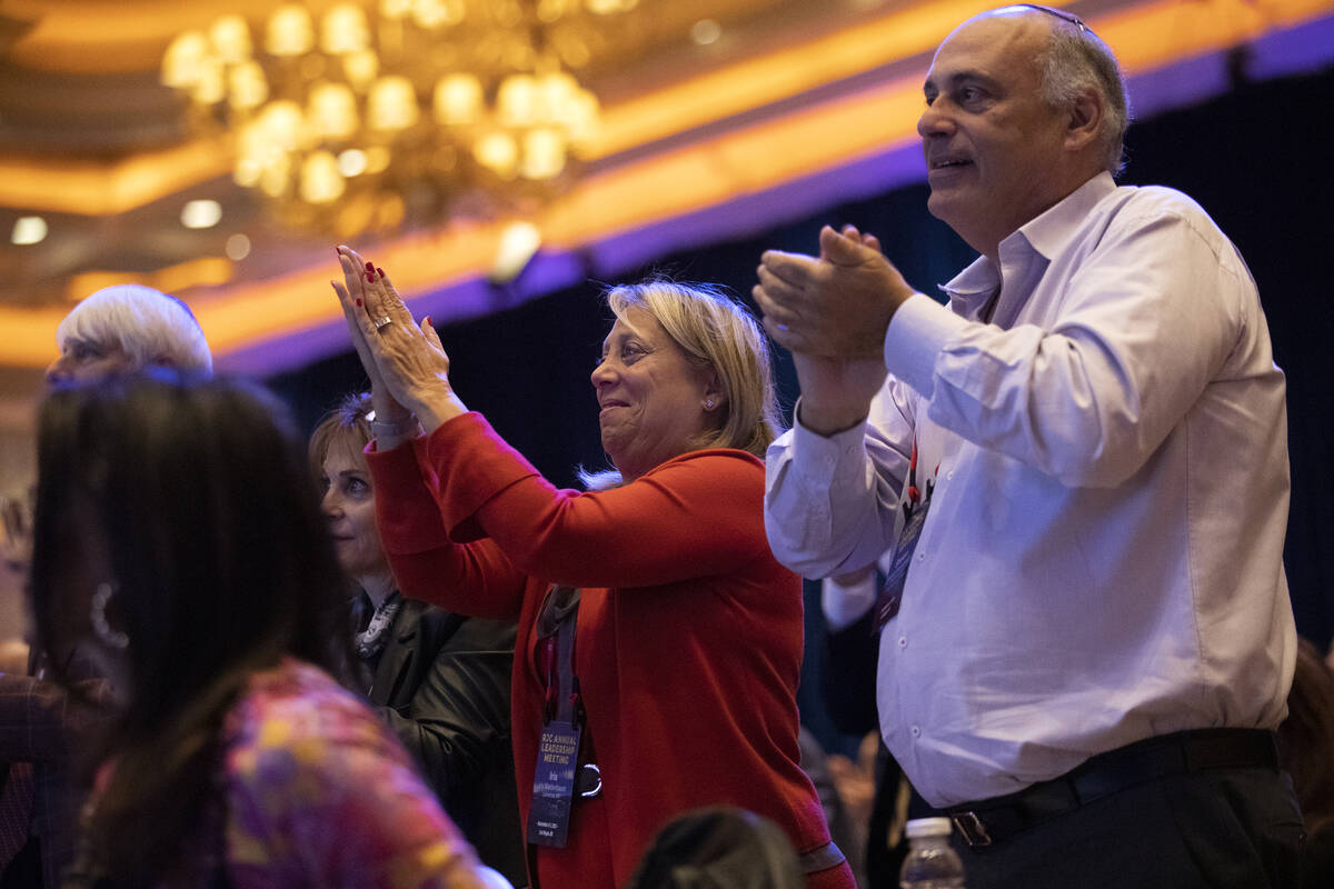 Audience members clap for speakers during the Republican Jewish Coalition's annual leadership m ...