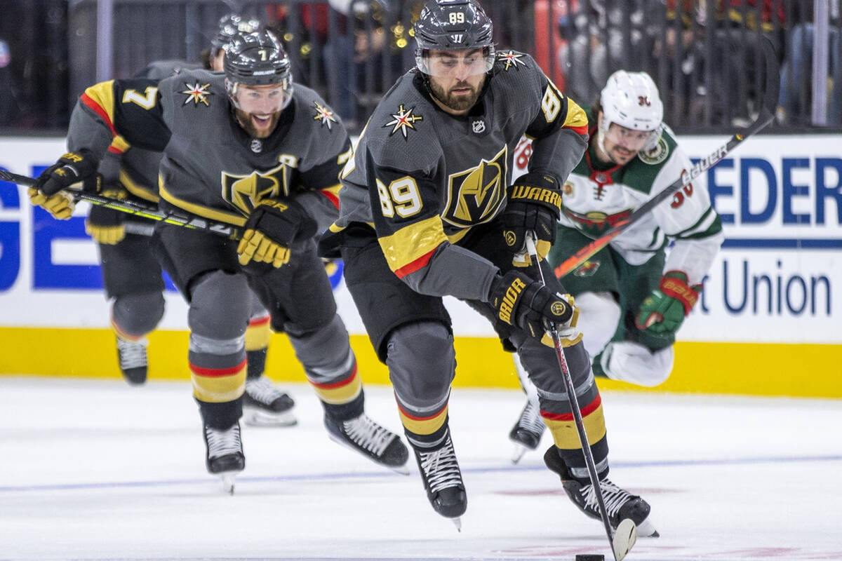 Golden Knights right wing Alex Tuch (89) breaks free up the ice for a shot attempt with teammat ...