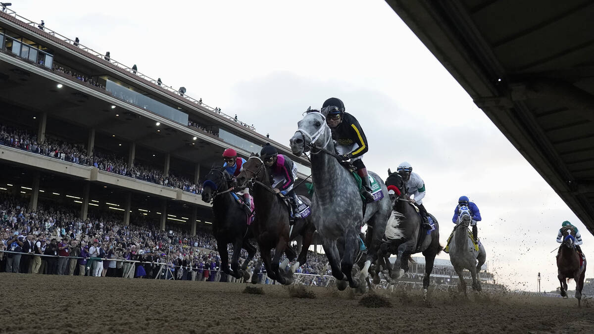 Joel Rosario rides Knicks Go, foreground, to victory during the Breeders' Cup Classic race at t ...