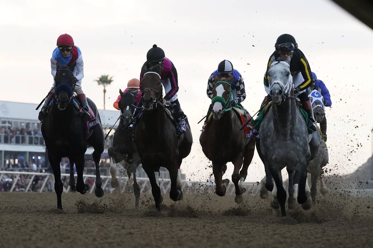 Joel Rosario rides Knicks Go, right, to victory during the Breeders' Cup Classic race at the De ...