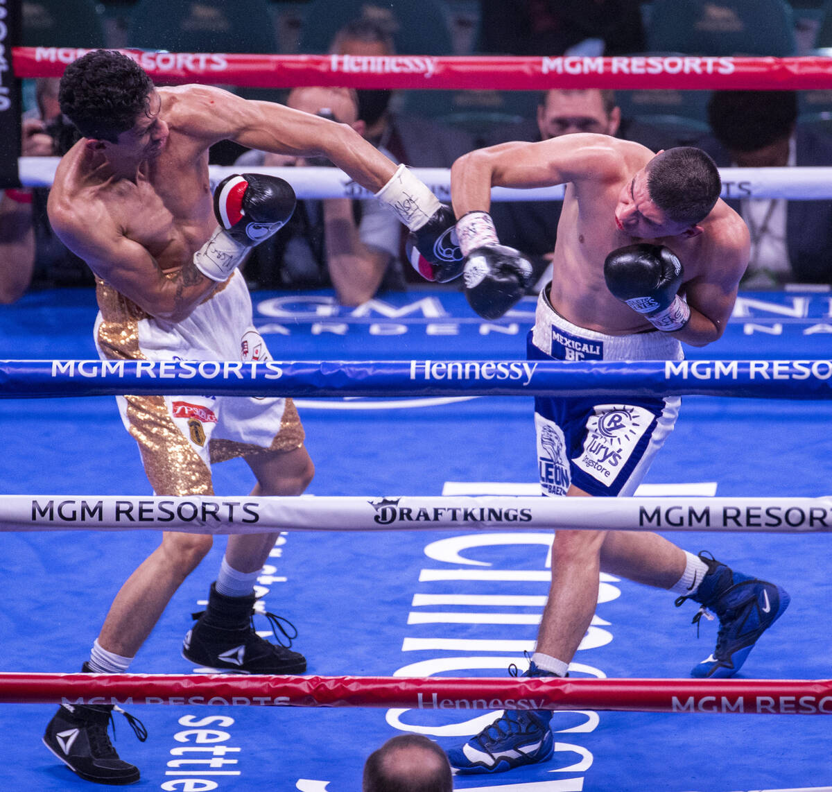 Rey Vargas and Leonardo Baez trade punches in the 5th round during their super bantamweight fig ...
