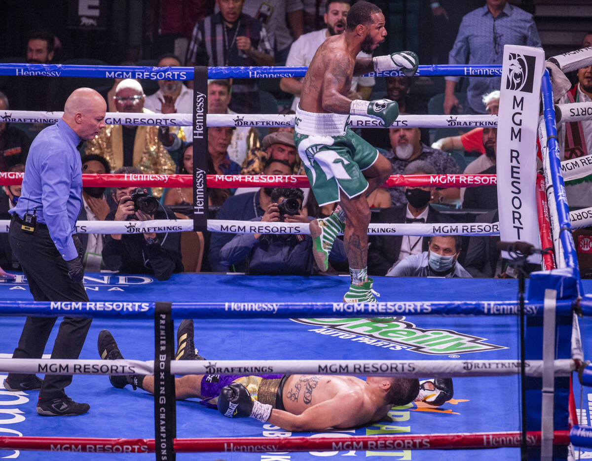 Marcos Hernandez is down on the canvas as Anthony Dirrell celebrates in the 4th round during th ...