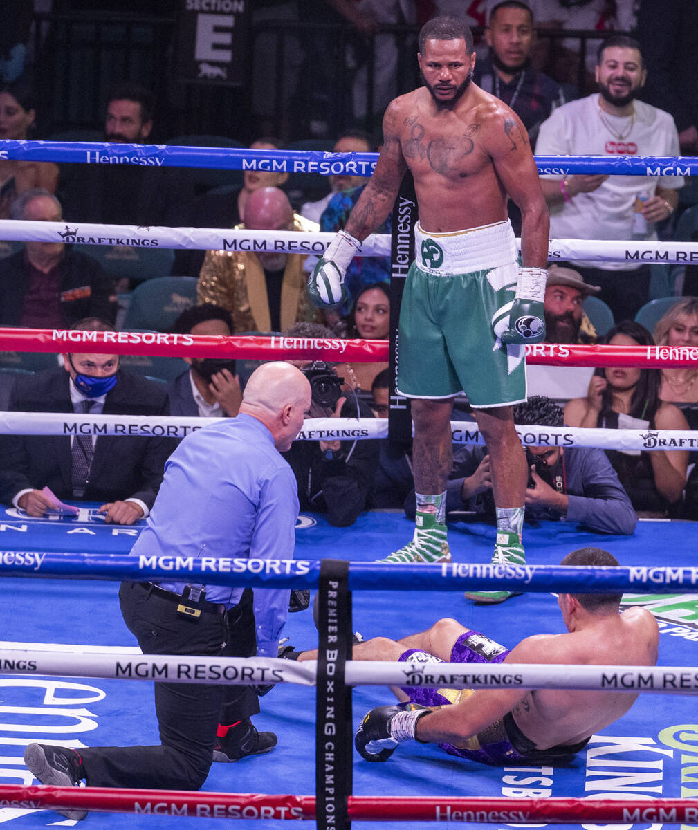 Anthony Dirrell looks to Marcos Hernandez down on the canvas in the 4th round during their supe ...