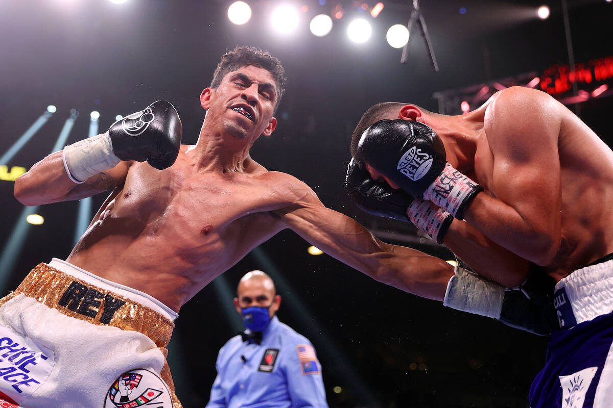 Rey Vargas, left, connects a punch against Leonardo Baez in the seventh round of a featherweigh ...