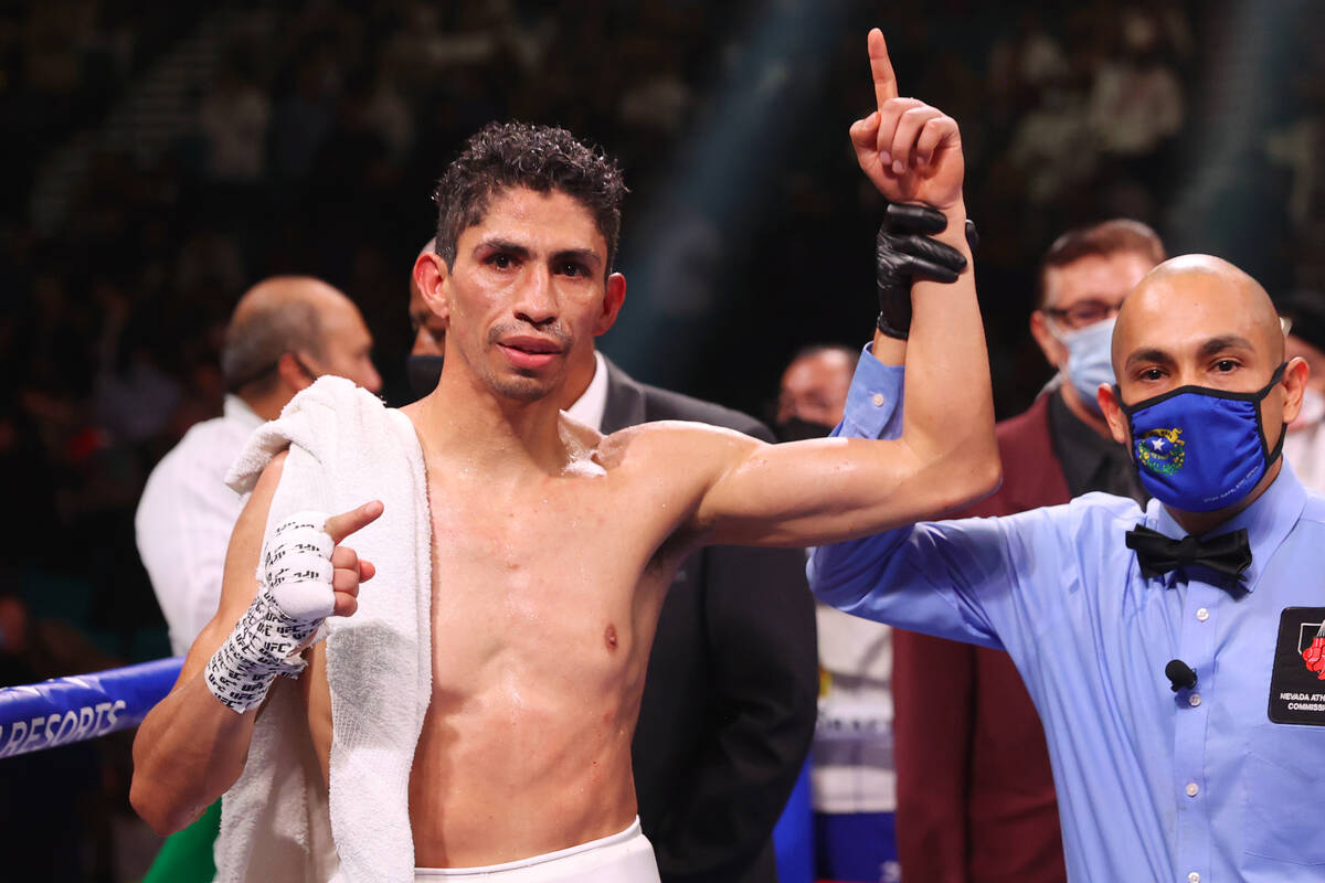 Rey Vargas Alvarez raises his hand in victory after his unanimous decision win against Leonardo ...