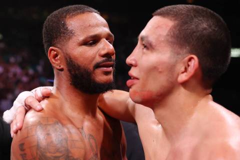 Anthony Dirrell, left, embraces Marcos Hernandez after his fourth round knockout win in a super ...