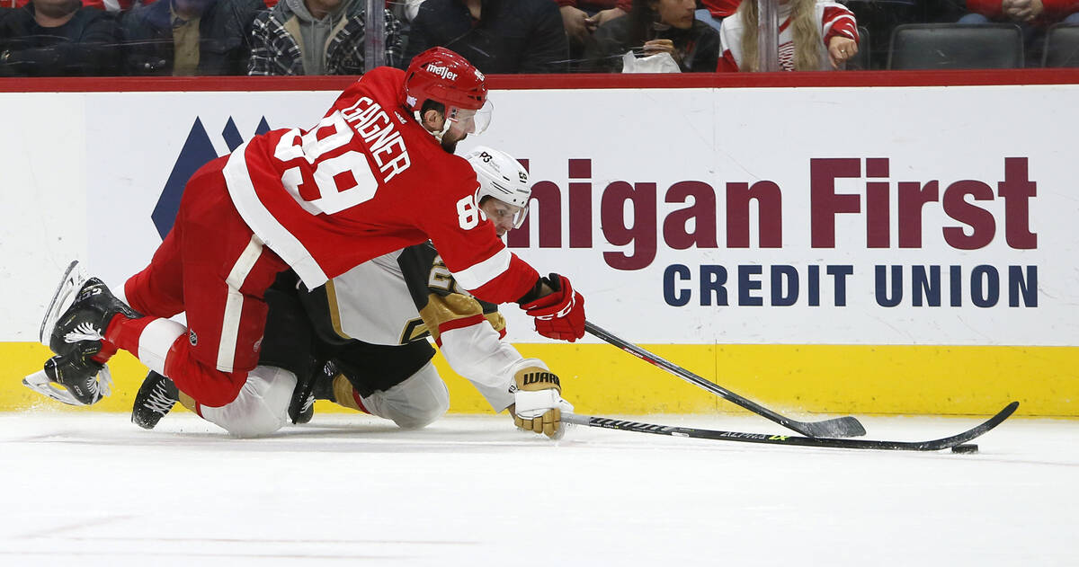 Detroit Red Wings center Sam Gagner (89) lands on Vegas Golden Knights center Mattias Janmark ( ...