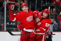 Detroit Red Wings left wing Lucas Raymond (23) celebrates with defenseman Moritz Seider (53) an ...