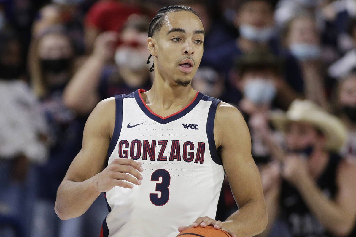 Gonzaga guard Andrew Nembhard controls the ball during the first half of a college basketball e ...