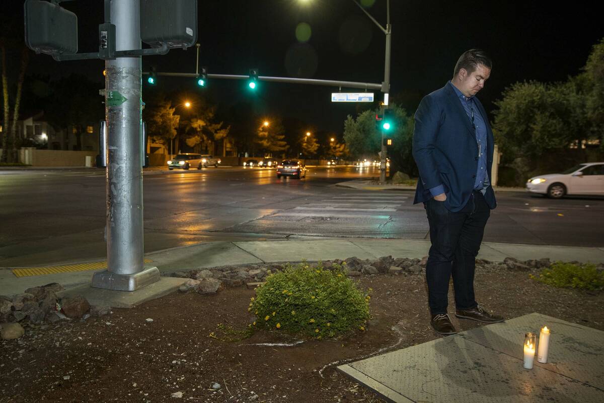 Andrew Bennett, public information officer with Zero Fatalities, stands after leaving a candle ...