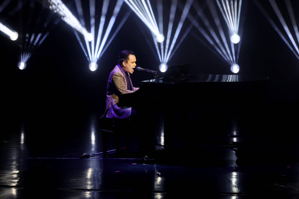 Illusionist Shin Lim is silhoutted onstage ahead of the reopening