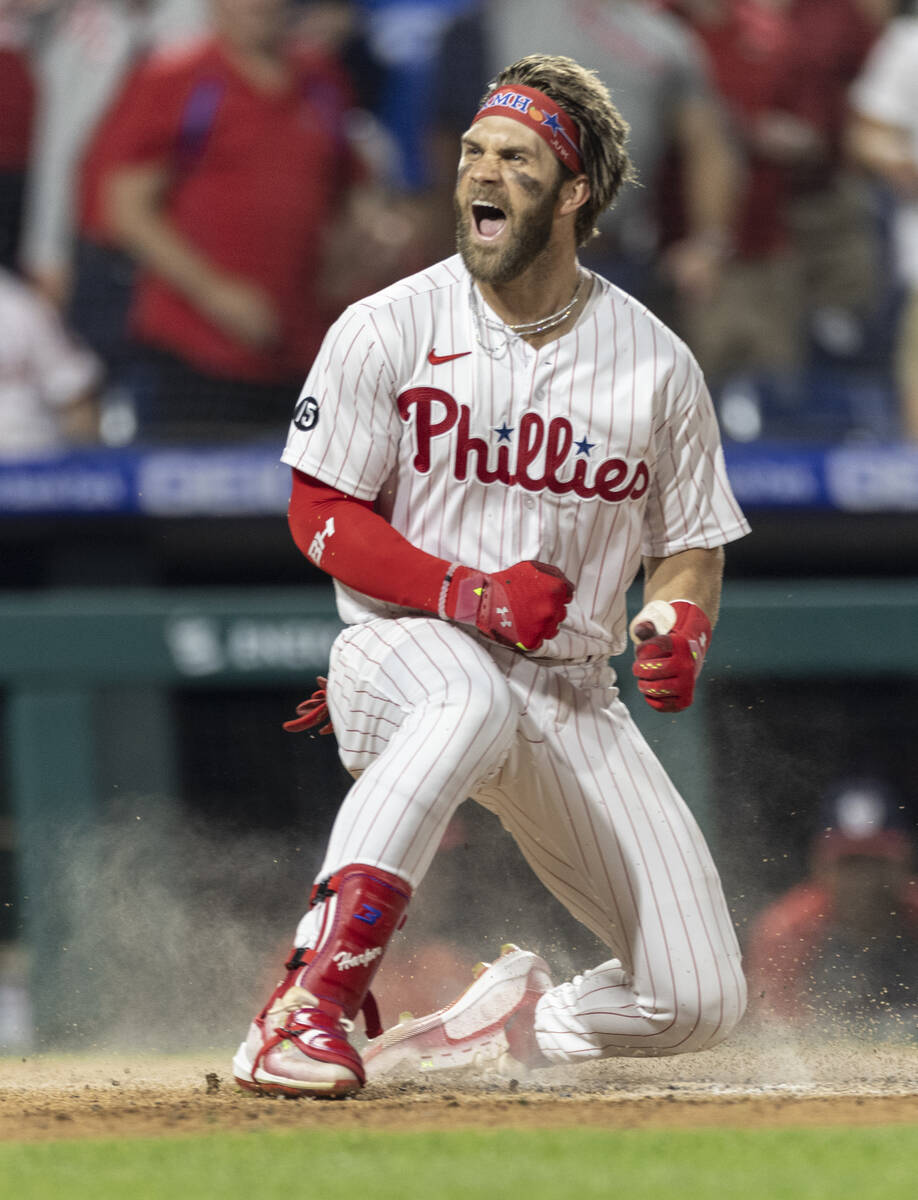 Philadelphia Phillies' Bryce Harper shouts at home plate after hitting an  inside-the-park home …