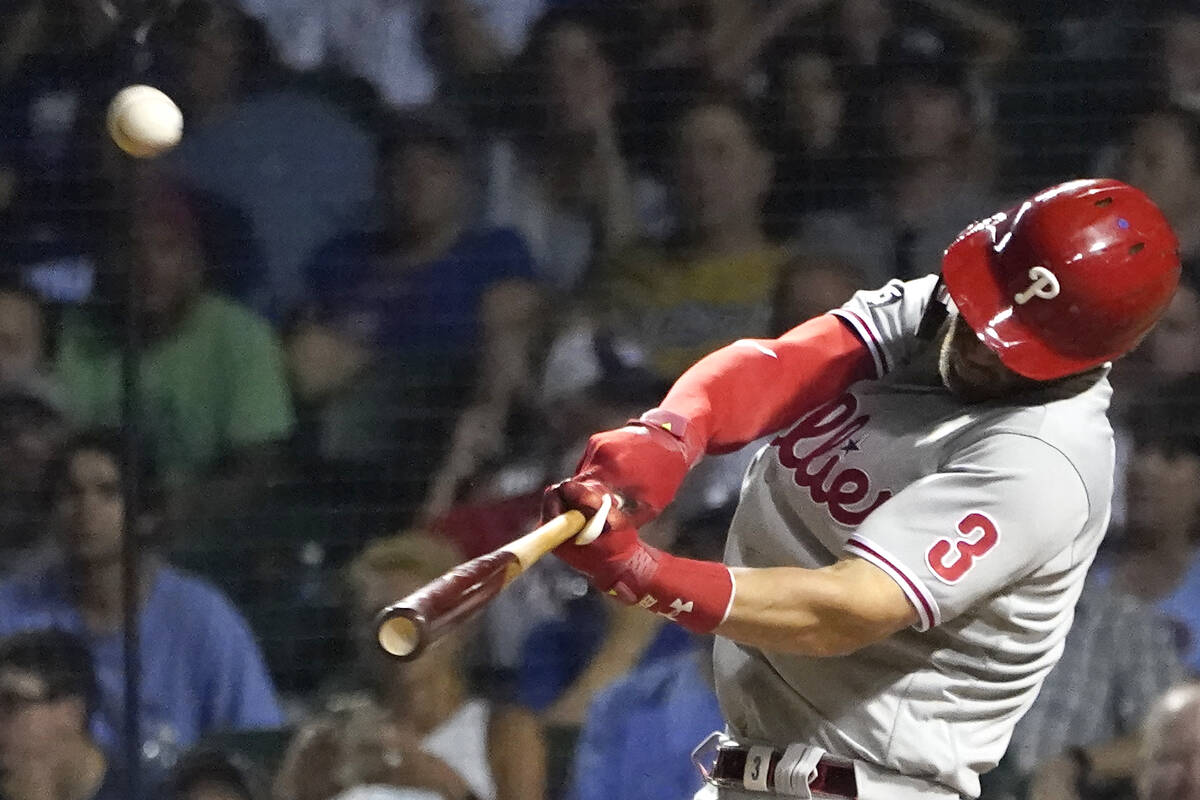 Philadelphia Phillies' Bryce Harper launches a three-run home run off Chicago Cubs relief pitch ...