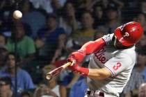 Philadelphia Phillies' Bryce Harper launches a three-run home run off Chicago Cubs relief pitch ...