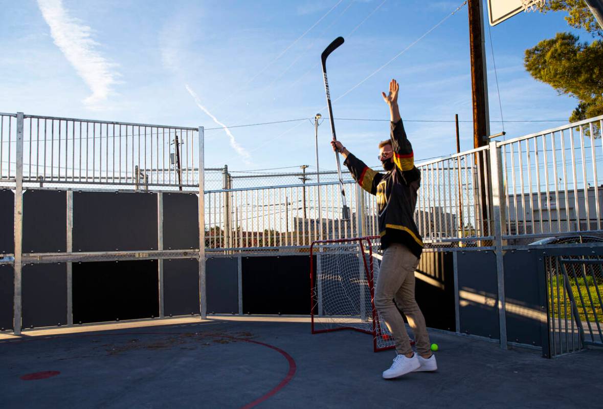 Newly acquired Golden Knights center Jack Eichel reacts after a goal as kids participate in a s ...