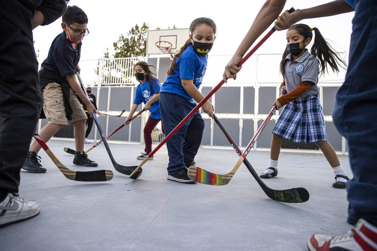 David, 8, participates with others in a youth hockey clinic at the James Clubhouse of the Boys ...