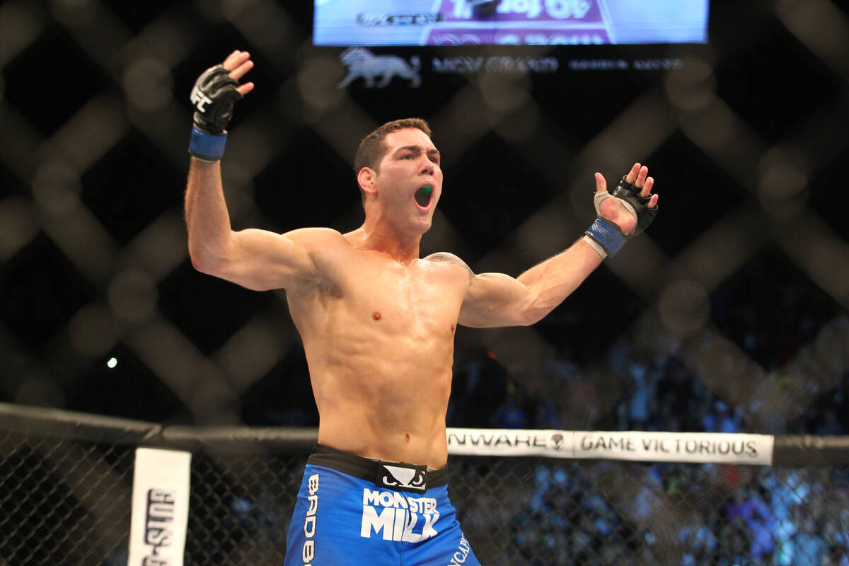 Chris Weidman reacts after defeating Anderson Silva in the Middleweight Championship fight duri ...
