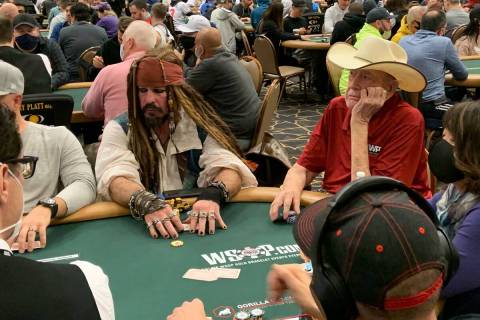 Doyle Brunson, right, plays next to Scotter Clark, dressed as Captain Jack Sparrow from the "Pi ...