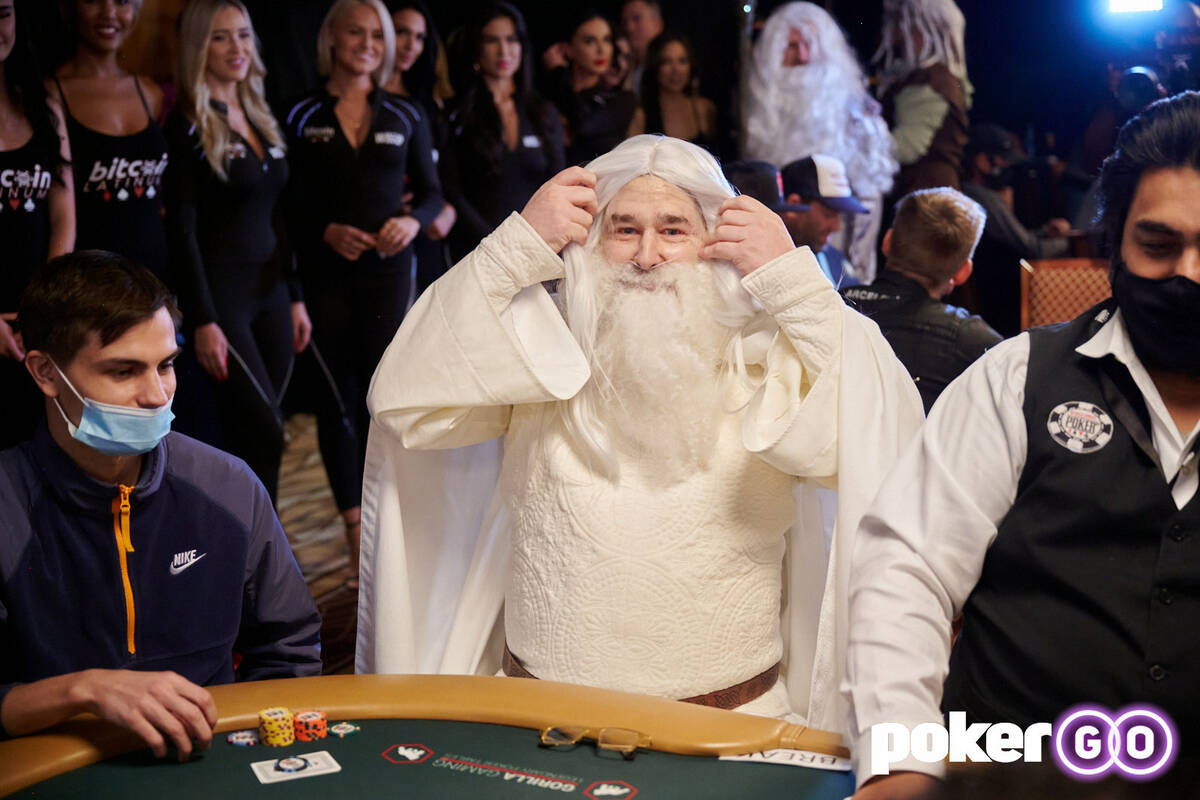 Phil Hellmuth sits down dressed as Gandalf the White from "The Lord of the Rings" on Day 1F of ...