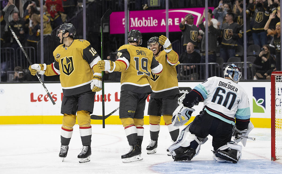 Vegas Golden Knights right wing Reilly Smith (19) celebrates with teammates Jonathan Marchessau ...