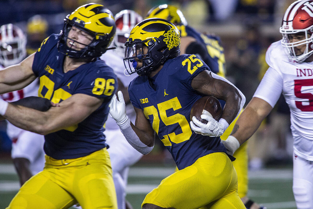 Michigan running back Hassan Haskins (25) rushes in the third quarter of an NCAA college footba ...