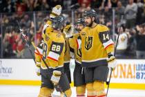 Vegas Golden Knights defenseman Nicolas Hague (14) and Vegas Golden Knights left wing William C ...