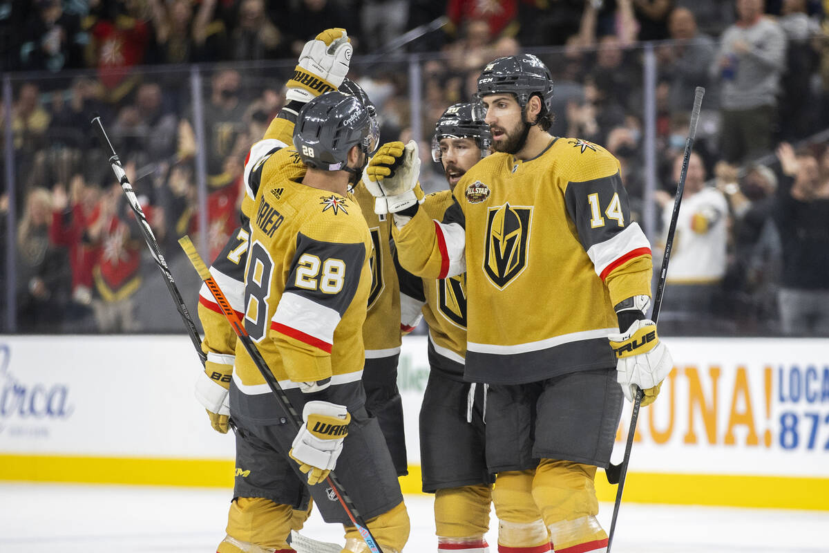 Vegas Golden Knights defenseman Nicolas Hague (14) and Vegas Golden Knights left wing William C ...