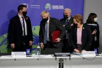 British Prime Minister Boris Johnson takes his seat alongside UNFCCC Executive Secretary Patric ...