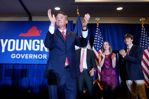 Virginia Gov.-elect Glenn Youngkin arrives to speak at an election night party in Chantilly, Va ...