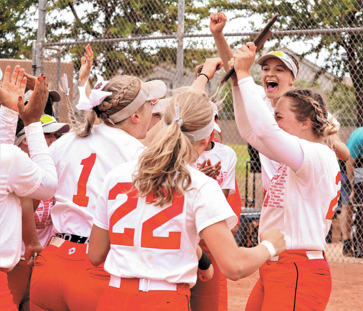 Arbor View pitcher Annie Finch (far right, holding trophy) celebrates with teammates after winn ...