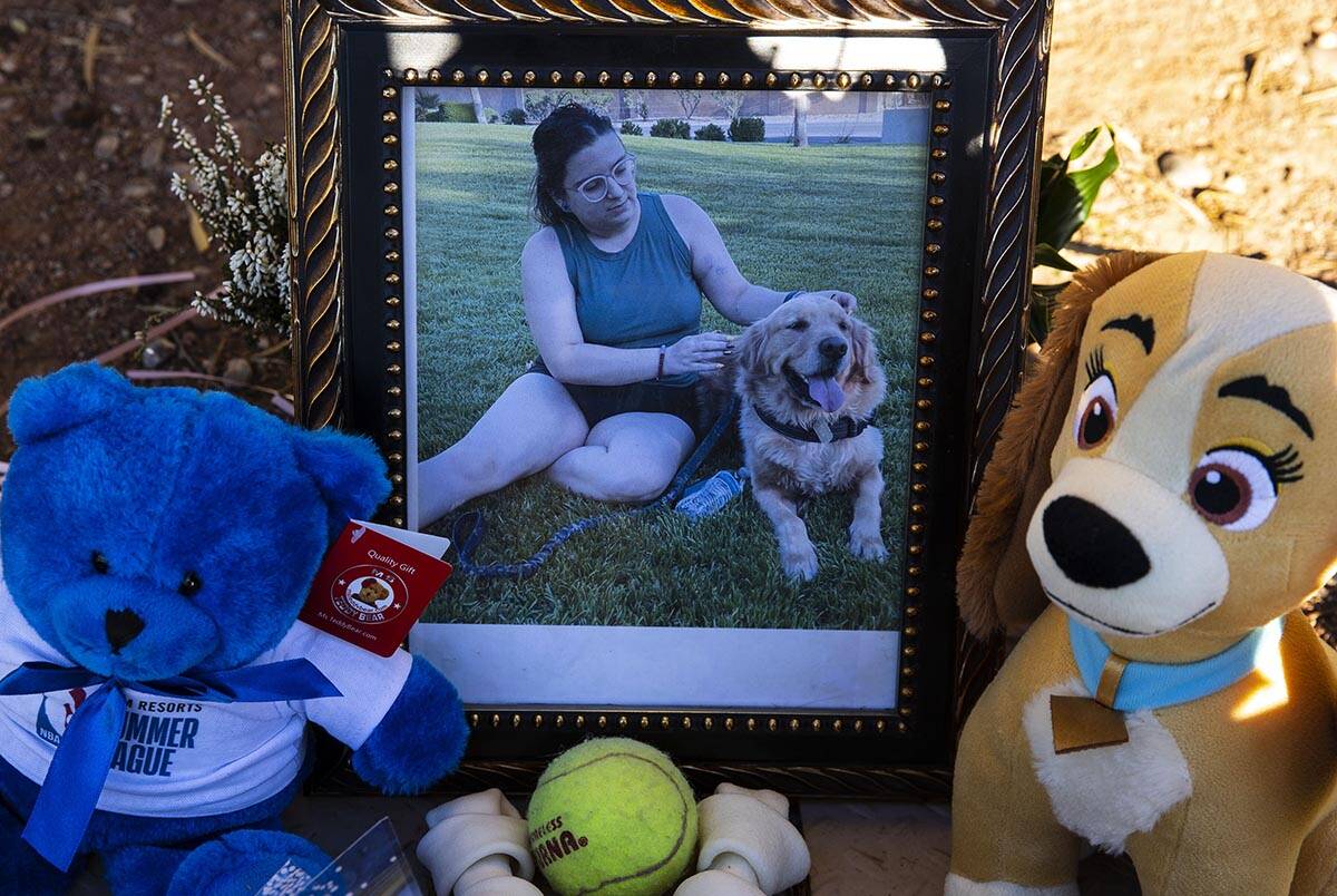 A photograph of Tina Tintor, 23, and her dog Max at a makeshift memorial site to honor them at ...